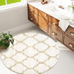 a bathroom with a round rug and sink