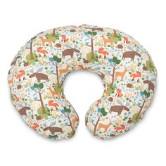 an image of a neck pillow with animals and trees on the front, in white background