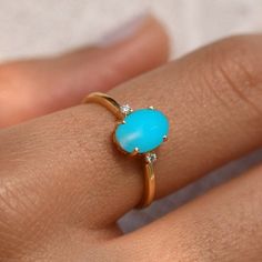 Oval Cut Turquoise Wedding Ring,14k Solid Gold,Sleeping Beauty Turquoise Ring,Three Stone Ring,Dainty Bridal Ring,Proposal Gift for Women's ★ ★ ★  CUSTOM/DUTY FREE SHIPPING WORLDWIDE, BUYERS DON'T HAVE TO PAY ANY CUSTOM FEES WHILE IMPORTING ★ ★ ★ ★  Details ★ Made to order Material: 14k/18k gold Color Options: Yellow Gold, White Gold, Rose Gold,  ★ Center Stone Sleeping Beauty Turquoise, Oval Size: 5x7 mm Approx Weight (Ct): 0.92 ★ Accent Stones Diamond/Moissanite Round Size: 1.5 mm * 2 No.s Approx Weight (Ct): 0.02 ★ Band Width: 1.3 mm ★ Ring Height: 7.5 mm ★ 100% Natural Diamond and Gemstones ★ Diamond: Round Brilliant cut, G-H Color, SI Clarity ☂ Shipped with Insured Shipping with 4-7 business days. ➦ 100% Free Returns. ➦ Our Jewelry comes with Lifetime Warranty. (Stone Replacement not Turqoise Rings, Turqoise Ring, Turquoise Wedding Ring, Turquoise Wedding Rings, Turquoise Ring Engagement, Ring Three Stone, Ring Proposal, Cute Engagement Rings, Turquoise Wedding