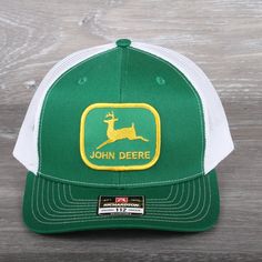 Vintage John Deere Green Patch on a Richardson 112 Trucker Snapback Hat Shape Mid-Pro Fabric Cotton-Poly/Nylon Mesh Visor Precurved Sweatband Cotton Material 60% Cotton, 40% Polyester Construction Woven/Knitted Adjustable Snapback OSFM (7 - 7 3/4) Hats are shipped in a poly bag and placed in a box to protect the hat. Green Trucker Baseball Cap For Spring, Spring Green Trucker Baseball Cap, Classic Green Hat One Size Fits Most, Classic Green Hat With Embroidered Logo, Green Spring Baseball Cap With Flat Bill, Green Flat Bill Baseball Cap For Spring, Classic Green Visor Hats, Spring Green Flat Bill Baseball Cap, Green Trucker Hat With Visor