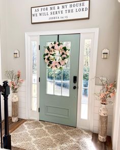 the front door is decorated with pink flowers