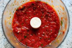 a food processor filled with marinara sauce