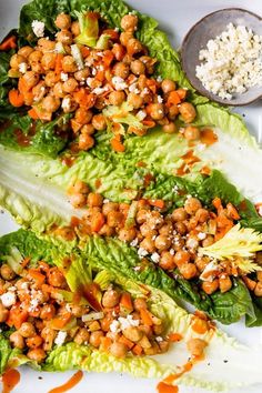 lettuce wraps with chickpeas, carrots and feta cheese on top