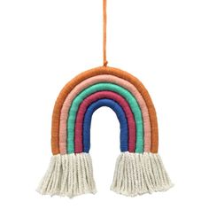 a multicolored rainbow hanging decoration with tassels