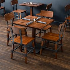 several wooden chairs and tables in a restaurant