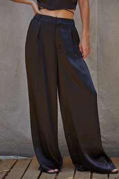 Woven satin trouser Pants! Great quality and super comfortable! Your classic trouser with a fancy twist! Model is wearing a size small. Black Satin Trousers Outfit, Saree Skirt, Baddie Vibes, Skirt Satin, Satin Trousers, Classic Trousers, Satin Pants, Closet Essentials, Black Trousers