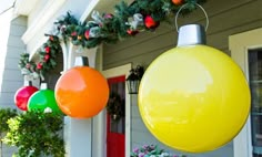 christmas decorations hanging from the side of a house with an advertise about them