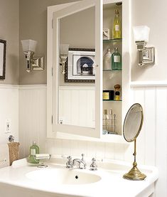 a bathroom with a sink, mirror and medicine cabinet in it's own area