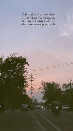 cars are driving down the road in front of trees and a sky background with a poem written on it