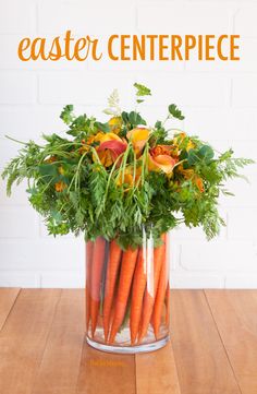 carrots are arranged in a glass vase with the words easter centerpiece