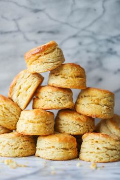 a stack of biscuits sitting on top of each other in front of a marble background