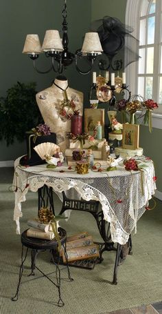 a table topped with lots of assorted items and lamps hanging from it's ceiling