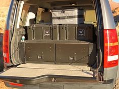 the back end of a van with several boxes in it's cargo compartment,