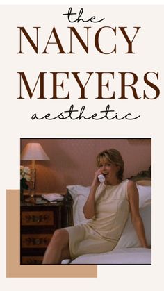 a woman sitting on top of a bed talking on a cell phone with the words, the nancy meyers aesthetic