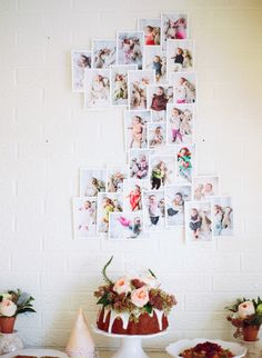 a table topped with cakes and pictures on the wall