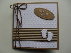 a close up of a greeting card with baby feet