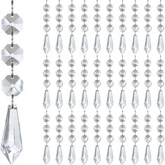 PRICES MAY VARY. CRYSTAL ICICLE CHRISTMAS ORNAMENTS BULK PACK OF 30: Bulk Hanging Crystals for Decoration for Centerpieces, Elegant Clear Acrylic Plastic Icicle Drop Crystal Dangle Ornaments Set for Christmas Tree Decorations, SIZE - 36mm Crystal Icicle Pendant x 1; 14mm Clear Octagon Beads x 3; 12mm Silver Metal Split Rings x 4; The total length of crystal icicles ornaments is 11cm long. CLEAR PLASTIC ACRYLIC CRYSTAL CHRISTMAS ORNAMENTS PREMIUM QUALITY: Lightweight, won't put too much pressure Icicle Chandelier, Crystal Garland, Crystal Centerpieces, New Year's Party Decorations, Mothers Day Decor, Hanging Crystals, Beaded Jewels, Crystal Ornament, Beaded Curtains