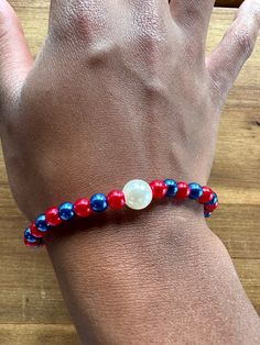 Cute bracelet to celebrate Independence Day with red white and blue Patriotic Round Beads Stretch Bracelet For 4th Of July, Blue Friendship Bracelets For 4th Of July Gift, Patriotic White Stretch Bracelet With Round Beads, Patriotic Blue Friendship Bracelets As Gift, Patriotic White Stretch Bracelet, Patriotic Jewelry With Colorful Beads As Gift, Patriotic Colorful Beaded Jewelry Gift, Patriotic Round Beads Jewelry Gift, Casual Multicolor Bracelets For 4th Of July