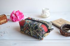 "Poppies box pouch with zipper closure along the top. Perfect to store your make up essentials in your box pouch, (the print placement on the fabric may vary). Measurements: Length: 6.7\" (17 cm); Width: 4.13\" (10.5 cm); Height: 2.4\" (6 cm). Exterior fabric: multicolored* upholstery Interior fabric: black* cotton 100 % --------------------- For custom size, other fabrics patterns or other quantity please contact me by Etsy conversation. --------------------- Other pouch, purse and etc.: https: Rectangular Box Bag With Zipper Closure For Gift, Rectangular Box Bag With Zipper Closure As Gift, Handmade Rectangular Cosmetic Bag For Everyday Use, Make Up Essentials, Boxy Pouch, Charger Bag, Bird Purse, Pouch With Zipper, Make Up Pouch