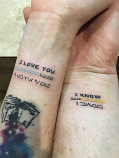 two people with matching tattoos on their arms