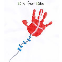 a drawing of a hand holding a string with the words k is for kite on it