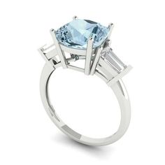 Style: Halo / Solitaire with Accents Stone: Natural Swiss Blue Topaz Main Stone Shape: Round Cut Main Stone Carat Weight: 1.0 Side Stone 1 Shape: Round Cut Side Stone 1 Carat Weight: 0.025 Side Stone 1 Size: 1.8mm Side Stone 1 Quantity: 12.0 Side Stone 2 Shape: Round Cut Side Stone 2 Carat Weight: 0.015 Side Stone 2 Size: 1.5mm Side Stone 2 Quantity: 14.0 Side Stone 3 Shape: Round Cut Side Stone 3 Carat Weight: 0.01 Side Stone 3 Size: 1.3mm Side Stone 3 Quantity: 32.0 Total Carat Weight: 1.83 Nu Wedding Halo, Blue Moissanite, Wedding Ring Sizes, Ring Size 10, Blue Tanzanite, Asscher Cut, Gold Engraving, Engagement Ring Sizes, Three Stone Engagement