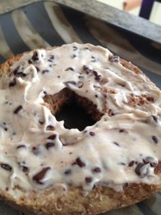 a frosted donut sitting on top of a plate