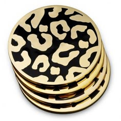 black and gold leopard print coasters stacked on top of each other