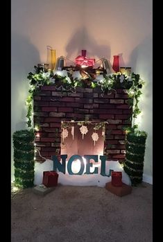 a fireplace decorated with christmas decorations and lights