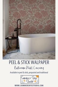 a bath tub sitting next to a wall with flowers on it and the words peel & stick