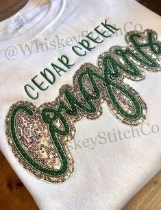 This listing is for an ADULT, SWEATSHIRT, **COUGARS** Sequin Embroidered 10 INCH Double Appliqué.  Other brand/style sweatshirts are available upon request There is an UPGRADE MY SWEATSHIRT listing Unisex sizing. These are MADE TO ORDER! COLORS/MATERIALS ARE COMPLETELY CUSTOMIZABLE.  OCCASIONALLY, SIZES/COLORS WILL SELL OUT, AND I HAVE TO USE A SUBSTITUTE BRAND. SHOULD THIS AFFECT YOUR ORDER, I WILL REACH OUT FOR THE BEST SOLUTION For any sizing recommendations please message me! Due to the nature of this item, I do not accept return or exchanges. HOWEVER, if there's an issue with your order, please contact me ASAP!! CARE: PLEASE PLEASE FOLLOW THESE CARE INSTRUCTIONS 💧 Machine wash cold, inside-out, gentle cycle with mild detergent and similar colors. *Mesh laundry bags are FANTASTIC for Cheerleading Tshirts Designs Ideas, Cheer Sweatshirt Ideas, Embroidered Spirit Wear, Cute Sweatshirt Designs Cricut, Hoco 2023, Wild Lily, Cheerleading Tshirts, Rhinestone Sweatshirt, Cheer Team Gifts