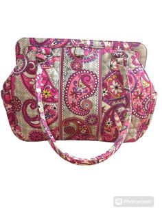 This beautiful Vera Bradley Frame bag in Paisley Meets Plaid pattern is the perfect addition to your collection. The exterior is made of quilted fabric in a lovely pink color and the interior lining also features a matching pink color. The bag is medium in size and has a satchel style. It is a retired piece from the Vera Bradley Frame product line, making it a unique and sought-after item. The bag is perfect for women who appreciate fashion and functionality. With the brand's signature pattern, this bag is sure to turn heads. It is ideal for everyday use or for special occasions. Make a statement with this stunning Vera Bradley Frame bag. Frame Bag, Quilted Fabric, Plaid Pattern, Favorite Things Gift, Vera Bradley, Purses And Handbags, Pink Color, Bags Handbags, Paisley