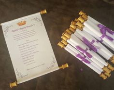 wedding ceremony program with purple ribbon and gold candles