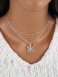 This simple snowflake necklace is made of pure 925 sterling silver and pairs well with our sterling silver satellite chain.  *Please note, these necklaces are not attached to each other. If you choose to purchase both, you can wear them individually or together. The snowflake necklace includes: - snowflake pendant (25 mm or 1 inch, including the bail) - anchor, rope, snake or curb chain (16 to 36 inches) The Satellite Chain Necklace includes: - a custom cut sterling silver satellite chain with a Snowflake Jewelry, Simple Snowflake, Snowflake Necklace, Winter Jewelry, Snowflake Pendant, Christmas Necklace, Chit Chat, Jewelry Christmas, Silver Christmas