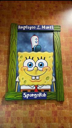 the spongebob sign is hanging on the wall