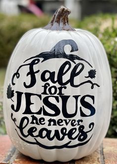 a white pumpkin with the words fall for jesus, he never leaves written on it