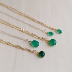 "Minimalist gemstone necklace featuring a natural Green Onyx. Each pendant is handmade from delicate wire securely wrapping the stone. You can coose between sterling silver or 14k gold filled wire. The pendant is suspended of a 14k gold filled or sterling silver chain. You can choose the material and your favourite gemstone from the drop down menu! Please insert the desired necklace length in the \"personalization\" box. STONE SHAPES: - oval shaped - round shaped - drop shaped STONE SIZES: - XS Dainty 14k Gold Filled Necklace With May Birthstone, Dainty 14k Gold Filled Necklace For May Birthstone, Minimalist May Birthstone Crystal Necklace, Silver Gemstone Necklace With 14k Gold Filling, Gold Wire Wrapped Sterling Silver Crystal Necklaces, Delicate Green Sterling Silver Necklaces, Handmade Gold Necklaces With Green Onyx, Handmade Gold Green Onyx Necklaces, Handmade Green Onyx Gold Necklace