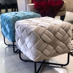 two different colored stools sitting on top of a tiled floor next to each other