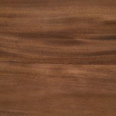 a close up view of a wooden surface with some grainy woodgrains on it