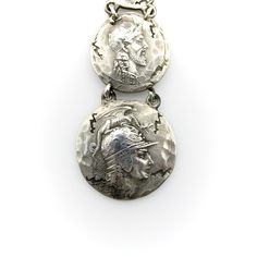 This is part of Chairish’s Costume Jewelry assortment.  This sterling silver fob features four graduated homeric medallions, dangling from a dog clip. Designed by George Shiebler, circa 1890’s, the piece was originally a watch fob; in contemporary use it makes a dramatic pendant when worn on a chain, or is great for a modern day watch enthusiast. The medallions are hand-hammered, with an ancient and cracked look to them—meant to make the piece look like it had come out of the many archaeological Collectible Historical Jewelry With Antique Finish, Collectible Antique Finish Historical Jewelry, Silver Coin-shaped Jewelry For Ceremonial Occasions, Silver Coin Jewelry For Ceremonial Occasions, Antique Silver Medallion Jewelry For Collectors, Historical Silver Medallion Jewelry, Historical Silver Jewelry As A Gift, Historical Engraved Medallion Jewelry, Victorian Silver Coin Pendant Jewelry