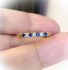 7 Stone Diamond Blue Sapphire Band/ 2.5mm Pave Alternating - Etsy Serbia Blue Sapphire Stackable Birthstone Ring, Blue Sapphire Half Eternity Ring As Gift, Blue Sapphire Ring With Half Eternity For Gift, Blue Sapphire Half Eternity Ring For Promise, Blue Half Eternity Round Ring, Blue Sapphire Half Eternity Ring In Cubic Zirconia, Blue Stackable Birthstone Ring With Round Band, Blue Sapphire Stackable Ring With Round Cut, Blue Birthstone Ring With Brilliant Cut For Anniversary