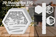 a wooden table with some cut outs on it and the words 3d shadow box vy