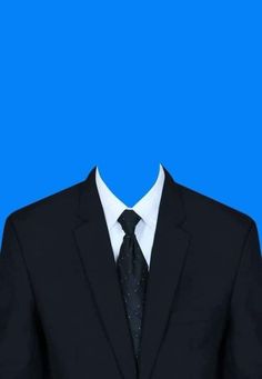 a man in a suit and tie standing against a blue background