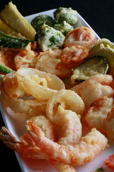 shrimp, broccoli and asparagus on a white plate