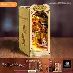 an advertisement for the book called falling sakura, featuring a doll's house in a box