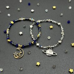 Low key matching Moon and Saturn friendship bracelets for couples/best friends/siblings. Handmade with  seed beads and moon charm on one bracelet, Saturn charm on the other. On stretchable string. Bracelets measure 7". There is some give to the bracelets, but please measure your wrist prior to ordering. *This is sold only as a set.* Beaded Bracelets With Charms For Friendship, Friendship Beaded Bracelets With Charms, Silver Beaded Bracelets With Moon Charm As Gift, Adjustable Beaded Bracelets With Moon Charm, Silver Bracelets With Moon Charm And Round Beads, Silver Bracelet With Moon Charm And Round Beads, Handmade Celestial Beaded Bracelets For Gifts, Celestial Style Beaded Bracelets As Gift, Friendship Bracelets For Couples