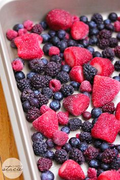 berries, raspberries and blueberries in a baking pan