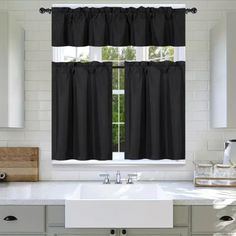 black and white kitchen curtains hanging in front of a window