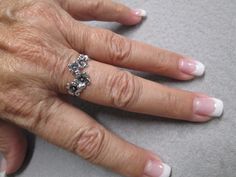 "Very pretty graduated flowers ring done in solid sterling silver. Nice detailing and craftmanship. The flowers look so delicate falling across your finger. At its widest it measures 1/2\". Various sizes in the dropdown. Stamped 925. New old stock, never worn." Flowers Ring, Silver Emerald Ring, Silver Flower Ring, Tiger Eye Jewelry, Flower Band, Topaz Color, Floral Ring, 925 Ring, Palm Beach Fl