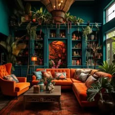 a living room filled with orange couches and lots of potted plants on top of them